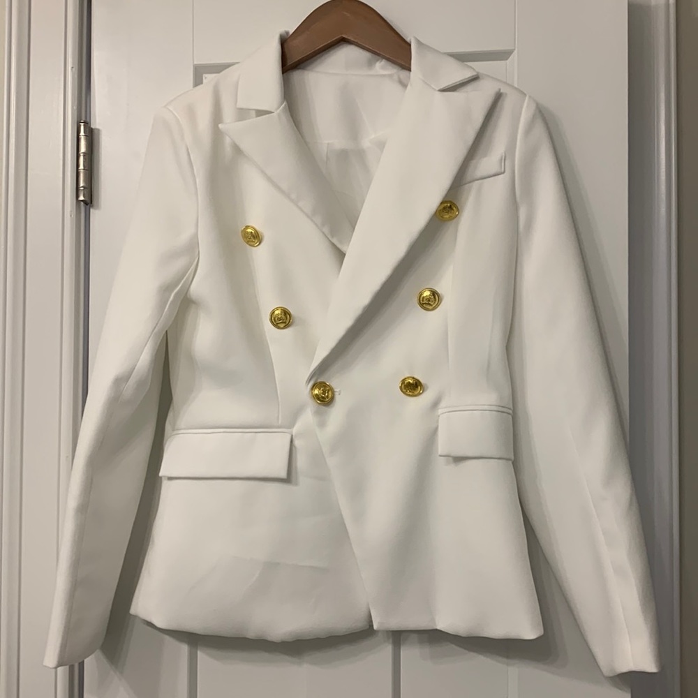 White blazer with large, gold nautical buttons